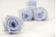 A Box Containing 8 Large Cool Lavender Eternal Rose Heads From Kiara