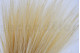 A bouquet of dried cream-colored barba, with and without packaging
