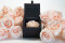 An elegant black box filled with one big preserved pink rose