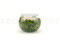 A round bowl containing a preserved peach rose set on preserved green hydrangea.