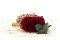 A romantic boutonniere in vibrant red tones, made with preserved flowers and foliage