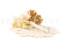A boutonniere for a special occasion in white and cream tones, made with preserved flowers and foliage.