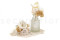 A boutonniere for a special occasion in white and cream tones, made with preserved flowers and foliage.