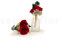 A romantic boutonniere in vibrant red tones, made with preserved flowers and foliage