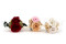 A romantic boutonniere in vibrant red tones, made with preserved flowers and foliage